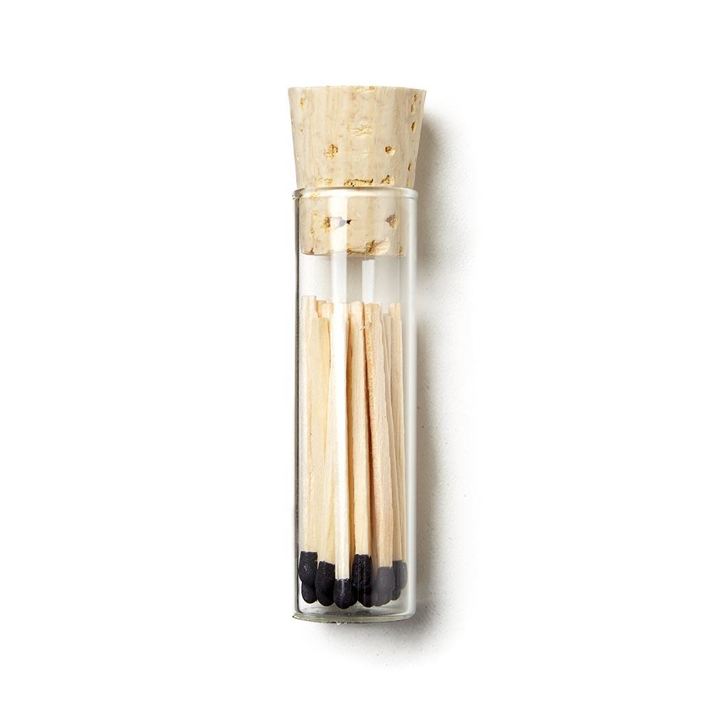 Vial of black tipped matches