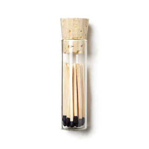 Vial of black tipped matches